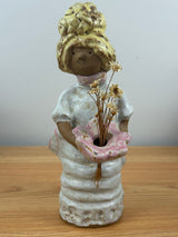 Metlox pottery Poppets BY Poppytrail. Girl with yellow hair, bustle dress carrying a basket for flower