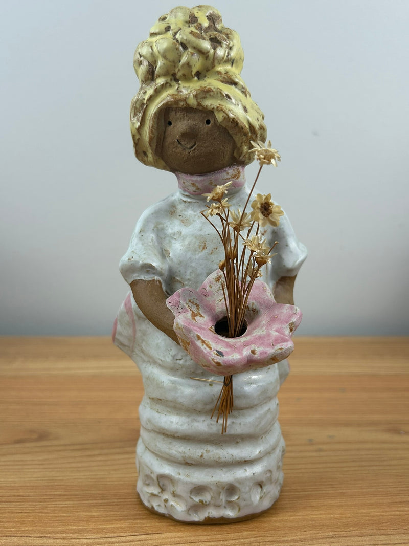 Metlox pottery Poppets BY Poppytrail. Girl with yellow hair, bustle dress carrying a basket for flower
