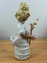 Metlox pottery Poppets BY Poppytrail. Girl with yellow hair, bustle dress carrying a basket for flower