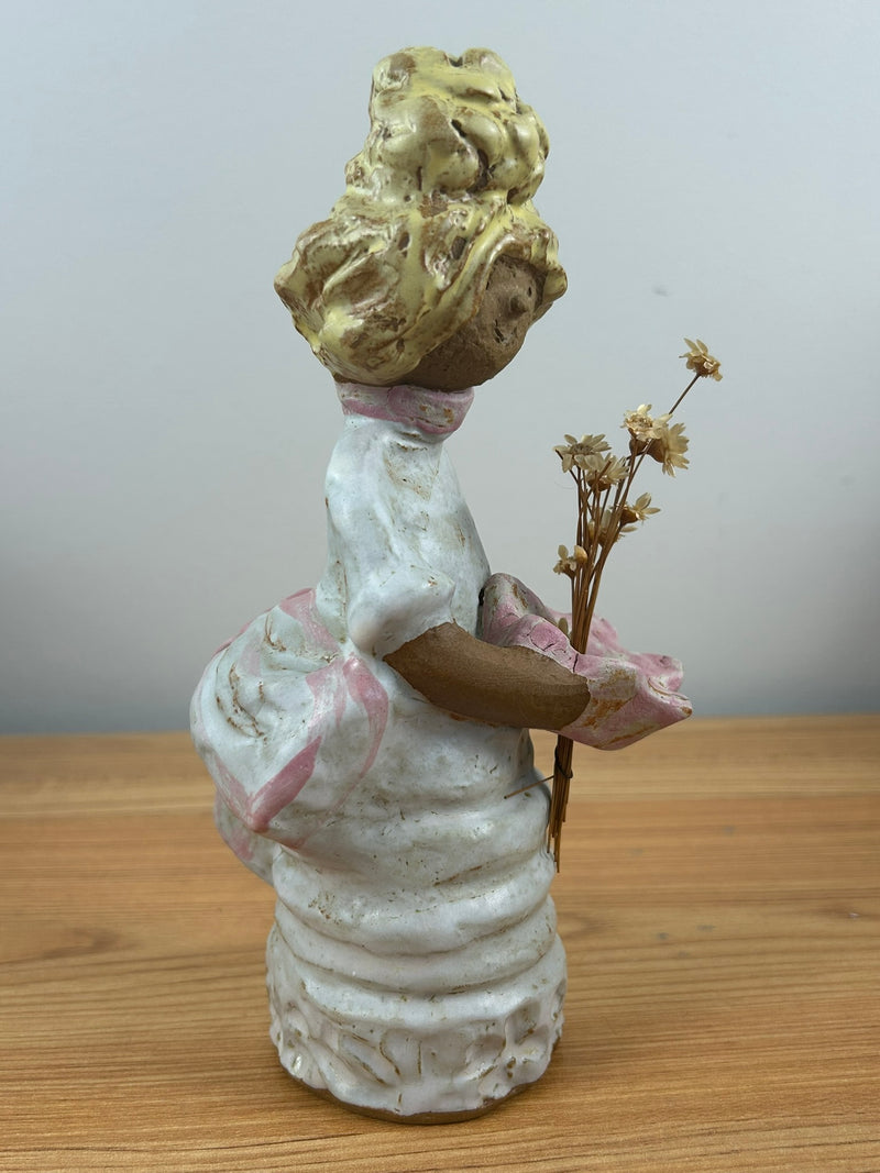 Metlox pottery Poppets BY Poppytrail. Girl with yellow hair, bustle dress carrying a basket for flower