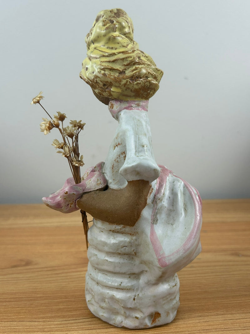 Metlox pottery Poppets BY Poppytrail. Girl with yellow hair, bustle dress carrying a basket for flower