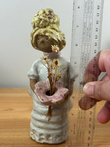 Metlox pottery Poppets BY Poppytrail. Girl with yellow hair, bustle dress carrying a basket for flower